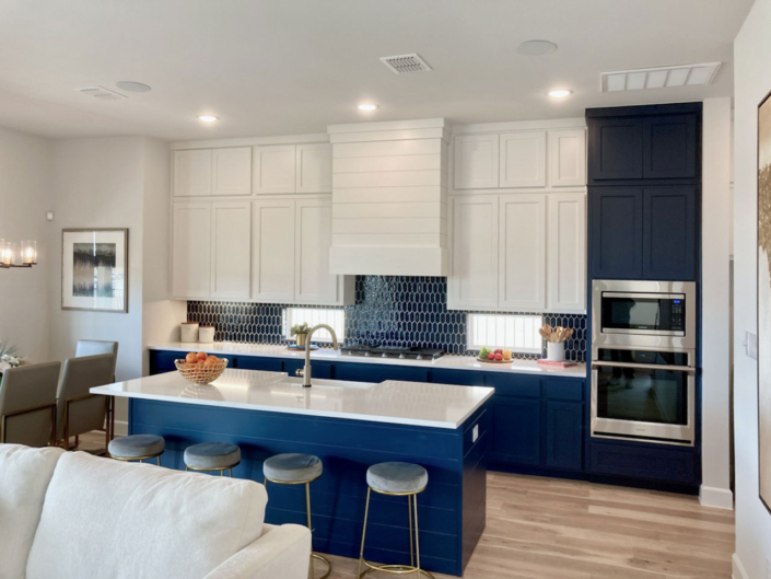 Kitchen with Naval blue shiplap island and Aransas Vent Hood
