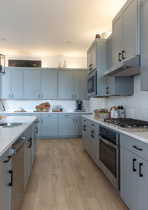 Kitchen island and buffet cabinets with Slim Shaker doors in Costa gray