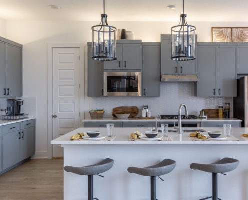 Kitchen cabinets with Slim Shaker doors in Costa and black pull handles