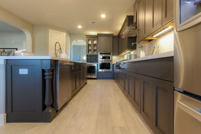 Burrows Cabinets' kitchen in Umber with Terrazzo doors and Monaco posts