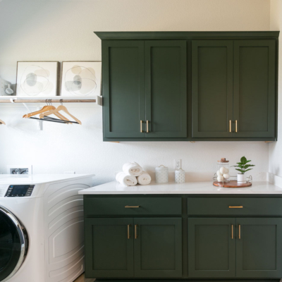 Laundry room upper and lower cabinets in Saba green with shaker doors