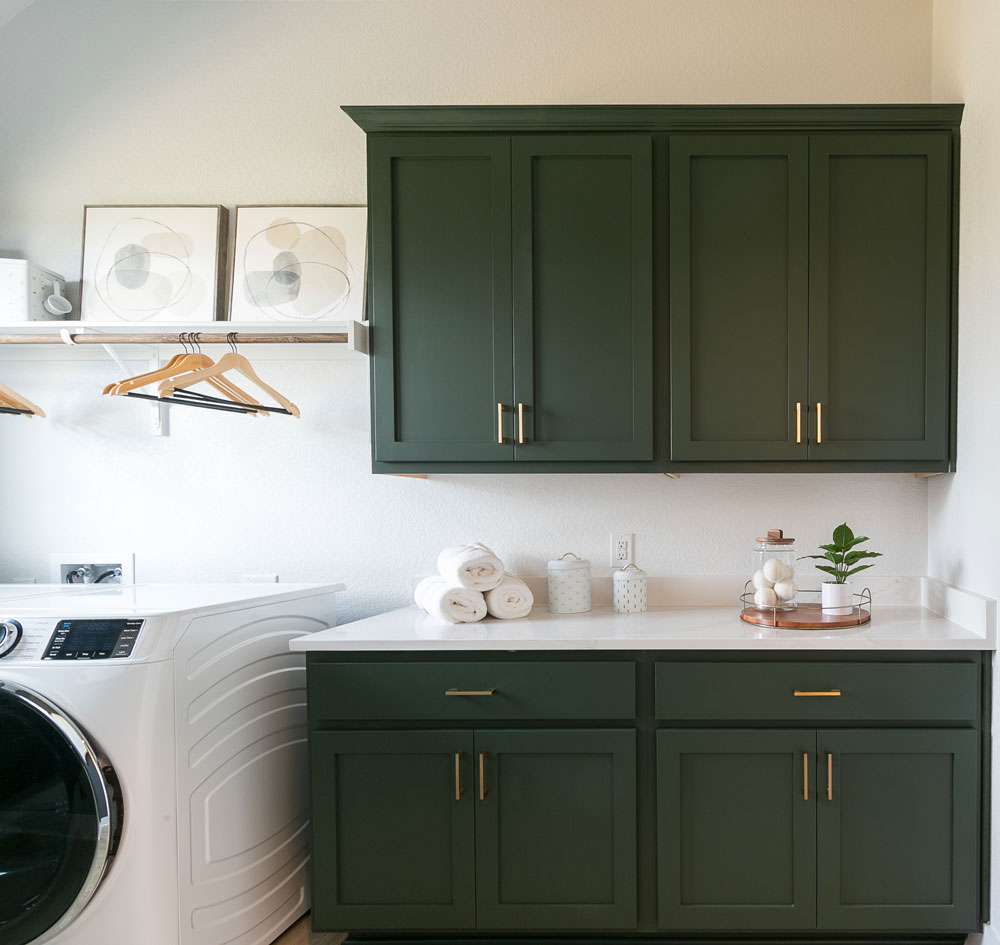 Laundry room upper and lower cabinets in Saba green with shaker doors