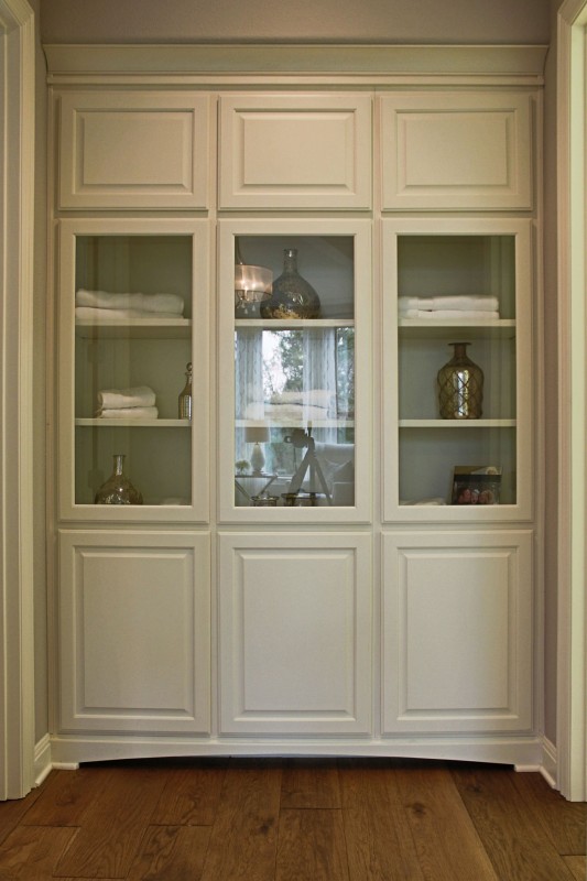 Burrows Cabinets' linen cabinets with glass doors in bone white