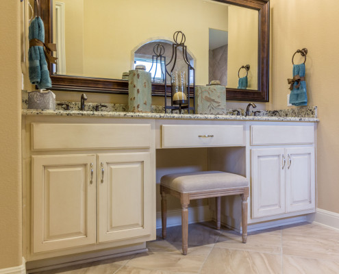 Burrows Cabinets' double vanity cabinet with "knee space" sitting vanity
