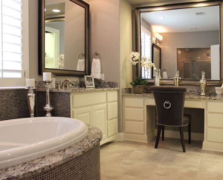Burrows Cabinets' primary bathroom with makeup vanity in bone white