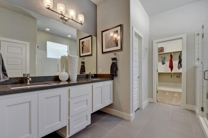 Burrows Cabinets' master bath with door style Terrazzo in Bone