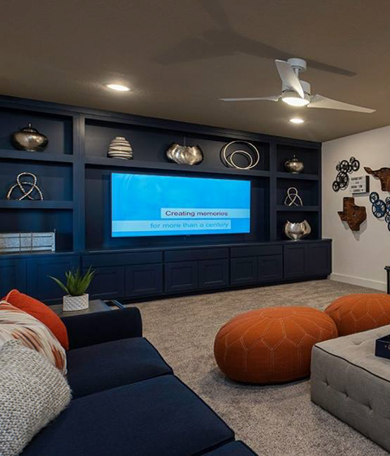 Burrows Cabinets' built-in media cabinets in Naval blue with Briscoe doors