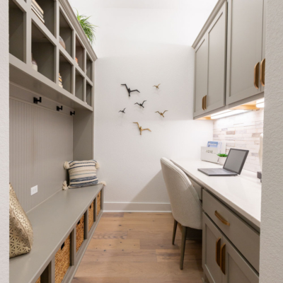 Mud room with built in cubbies, desk and storage cabinets in Bristol with Shaker doors