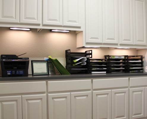 Burrows Cabinets office wall cabinets with undermount lighting