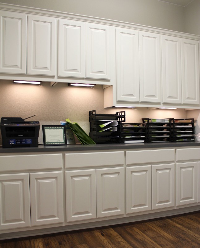 Burrows Cabinets office wall cabinets with undermount lighting