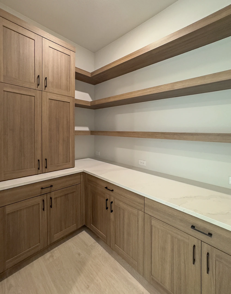 Pantry with built in cabinets in Reveur with 5 piece doors and floating shelves