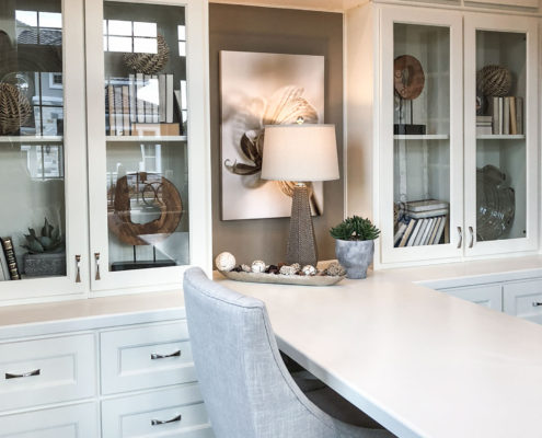 Burrows Cabinets' built-in study cabinets in Bone white with Terrazzo doors