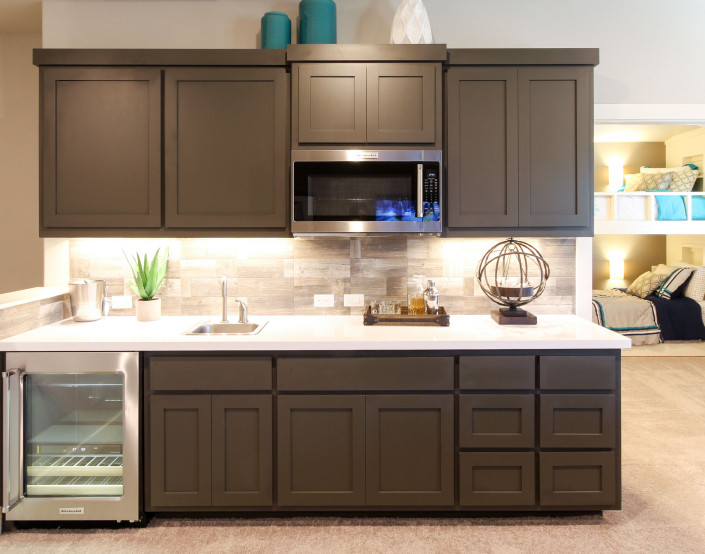 Burrows Cabinets' wet bar in Umber with Shaker doors
