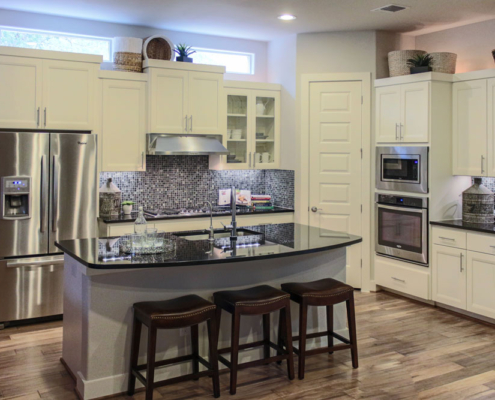 White kitchen cabinets with black countertops-Briscoe door